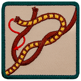 This square badge displays step two on how to make a square knot. Now cross the right side over the left and wrap around the other.