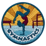 A gymnast in a pink leotard poses above the word Gymnastics.