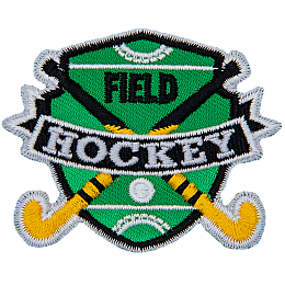 Two hockey sticks are crossed over each other with a ball on the shield-shaped field behind them. The words Field Hockey are stitched across the middle.