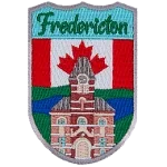 Fredericton’s City Hall is shown in front of the Canadian Flag.
