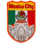 Mexico City’s Palacio de Bellas Artes is in front of the Mexican Flag.