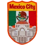 Mexico City’s Palacio de Bellas Artes is in front of the Mexican Flag.