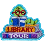 A green bookworm reads a book on top of two books. The spines read Library Tour.