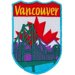 A suspension bridge in front of the Canadian Rockies and the Canadian flag. The name Vancouver is over it.