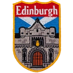 A large castle is in front of the Scottish Flag. The name Edinburgh is at the top of the shield-shaped patch.