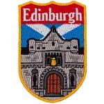 A large castle is in front of the Scottish Flag. The name Edinburgh is at the top of the shield-shaped patch.