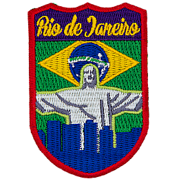 The words Rio de Janeiro are above Christ the Redeemer, which overlooks a blue silhouette of the city. The flag of Brazil is in the background.