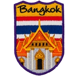 Bangkok is embroidered above an orange, Thai-style building. The flag of Thailand replaces the sky.