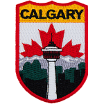 The name Calgary is at the top of the patch. The Calgary Tower is in the center in front of the mountains. The Canadian flag replaces the sky.