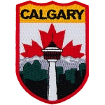 The name Calgary is at the top of the patch. The Calgary Tower is in the center in front of the mountains. The Canadian flag replaces the sky.