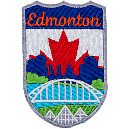 This emblem has the name Edmonton at the top on a blue background. In the section below, the name is Edmonton's famous landmarks. From bottom to top are the three pyramids of the Muttart Conservatory, the Waterdale Bridge, the North Saskatchewan River, and downtown Edmonton (including the Legislature Building). The background is a red maple leaf on a white backing.