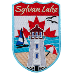 The name Sylvan Lake sits above a lighthouse on a beach. The sky is the flag of Canada.