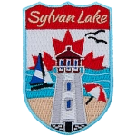 The name Sylvan Lake sits above a lighthouse on a beach. The sky is the flag of Canada.