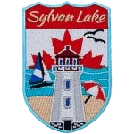 The name Sylvan Lake sits above a lighthouse on a beach. The sky is the flag of Canada.