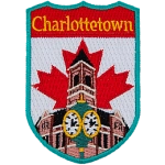 This shield-shaped crest has the text Charlottetown at the top. The iconic clock in front of Charlottetown city hall is displayed with the flag of Canada behind it.