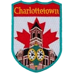 This shield-shaped crest has the text Charlottetown at the top. The iconic clock in front of Charlottetown city hall is displayed with the flag of Canada behind it.