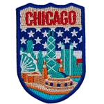 The skyline of Chicago is in front of the flag of America. The name Chicago is at the top.