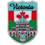 The word Victoria is above the parliament building in Vancouver. The flag of Canada is in the background.