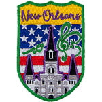 New Orleans is stitched above the St. Louis Cathedral surrounded by musical notes. The sky is the USA flag.