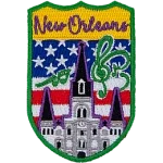 New Orleans is stitched above the St. Louis Cathedral surrounded by musical notes. The sky is the USA flag.