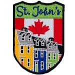 This shield-shaped crest has the text St. John's at the top. The iconic Jellybean Row of the city is displayed with the Canada flag in the background.