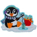 A little penguin in winter gear sits on the ice, fishing.