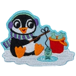 A little penguin in winter gear sits on the ice, fishing.