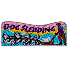 The words Dog Sledding are above a dog sled pulled by three dogs.