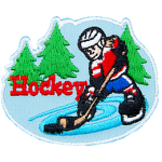 A hockey player skates on pond ice with evergreen trees in the background. The word Hockey is embroidered next to the player.