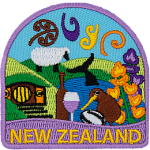 Rolling hills, sheep, flowers, kiwi, wine, and more decorate this New Zealand patch.