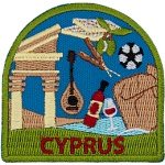 Kebabs, grapes, ancient structures, the ocean, wine, a soccer ball, and a lute are framed by a green border. Cyprus is embroidered below.