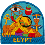 A collection of Egyptian symbols are in front of a pyramid. Such as a camel, pharaoh, bags of spices, and the eye of Ra.