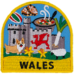 A welsh castle, corgi, sheep and leek are amongst the many symbols of Wales on this patch. The name Wales is at the bottom.