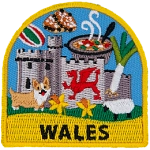 A welsh castle, corgi, sheep and leek are amongst the many symbols of Wales on this patch. The name Wales is at the bottom.
