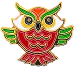 A red-bodied owl has its green wings spread wide and is staring straight at the viewer.