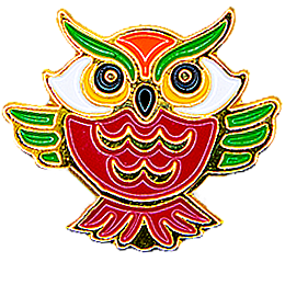 A red-bodied owl has its green wings spread wide and is staring straight at the viewer.