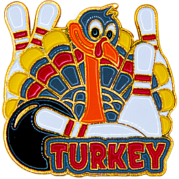 A turkey holds two bowling pins as three more pins peak out from behind its tail feathers. The word Turkey sits underneath.