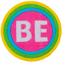 The word Be is encompassed by a pink, blue, green and yellow stripe.