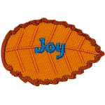 An orange leaf with blue text that reads Joy.