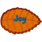 An orange leaf with blue text that reads Joy.