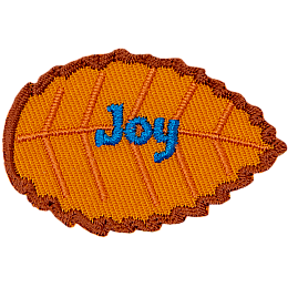 An orange leaf with blue text that reads Joy.