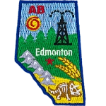 This patch is shaped like the province of Alberta and decorated with the Rocky Mountains, trees, wheat, fossils, and a derrick.