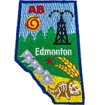 This patch is shaped like the province of Alberta and decorated with the Rocky Mountains, trees, wheat, fossils, and a derrick.