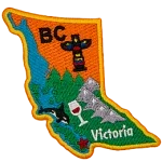 This badge is shaped like the province of British Columbia. It is decorated with BC symbols and its coastline.