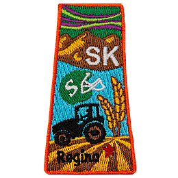 This patch is in the shape of the Canadian province of Saskatchewan with symbols such as the northern lights, grasslands, mountains, prairies, a tractor and a football helmet.