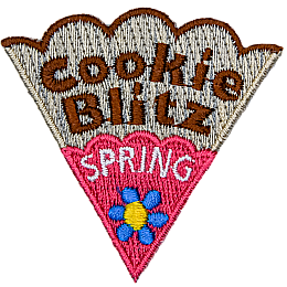 The words Cookie Spring Blitz are on a cookie slice with pink icing and a blue flower.