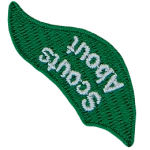The words Scouts About are stitched on a green flame.
