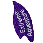 The words Extreme Adventure are stitched on a purple flame.