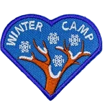 A snow-covered tree branch. The words Winter Camp are embroidered above them.