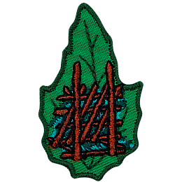 A shelter made from sticks on a green leaf.